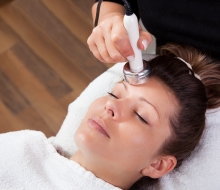 Young woman receiving laser therapy