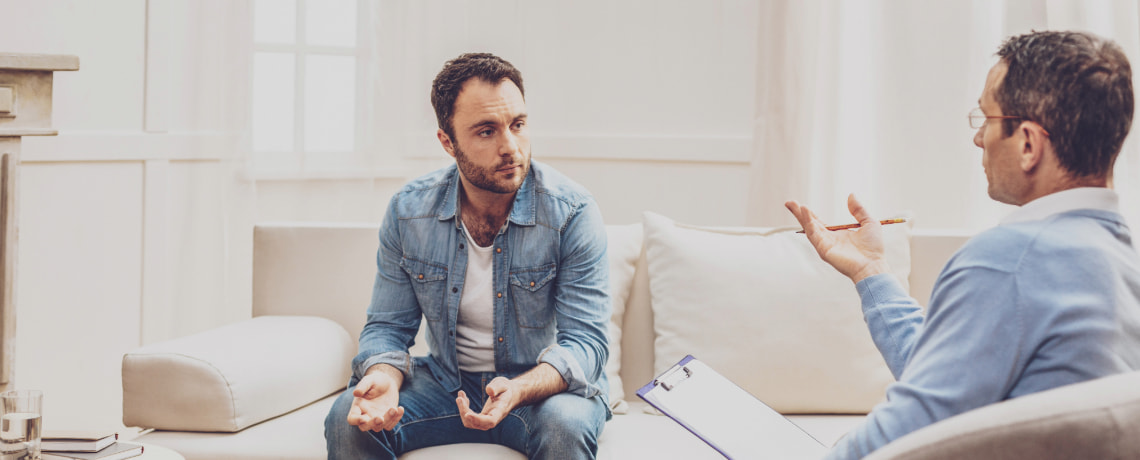 Man sitting with his Therapist